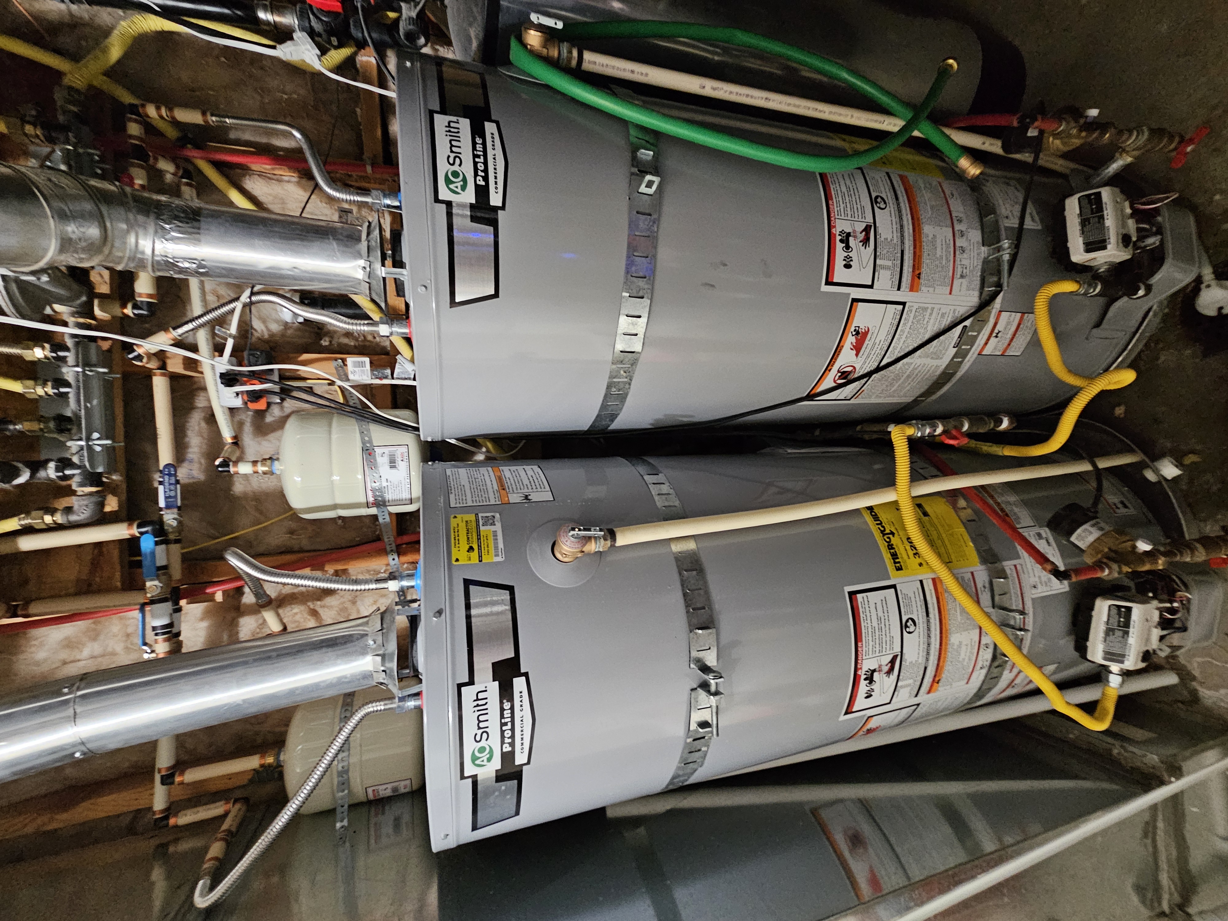 Two A.O. Smith ProLine 50-gallon gas water heaters installed side by side in Highland, Utah