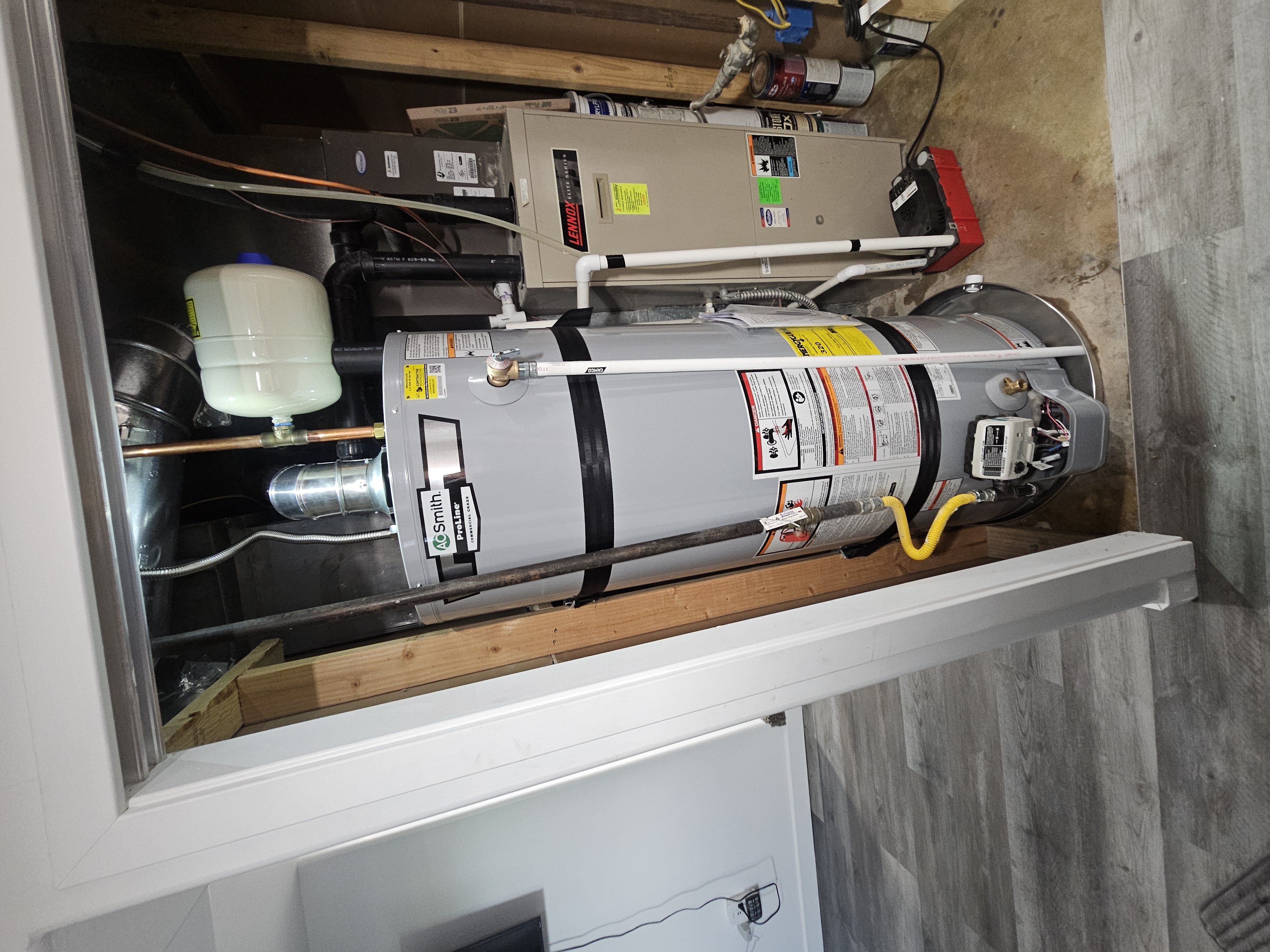 A.O. Smith ProLine gas water heater installed in a utility closet of an Ogden, Utah rental property