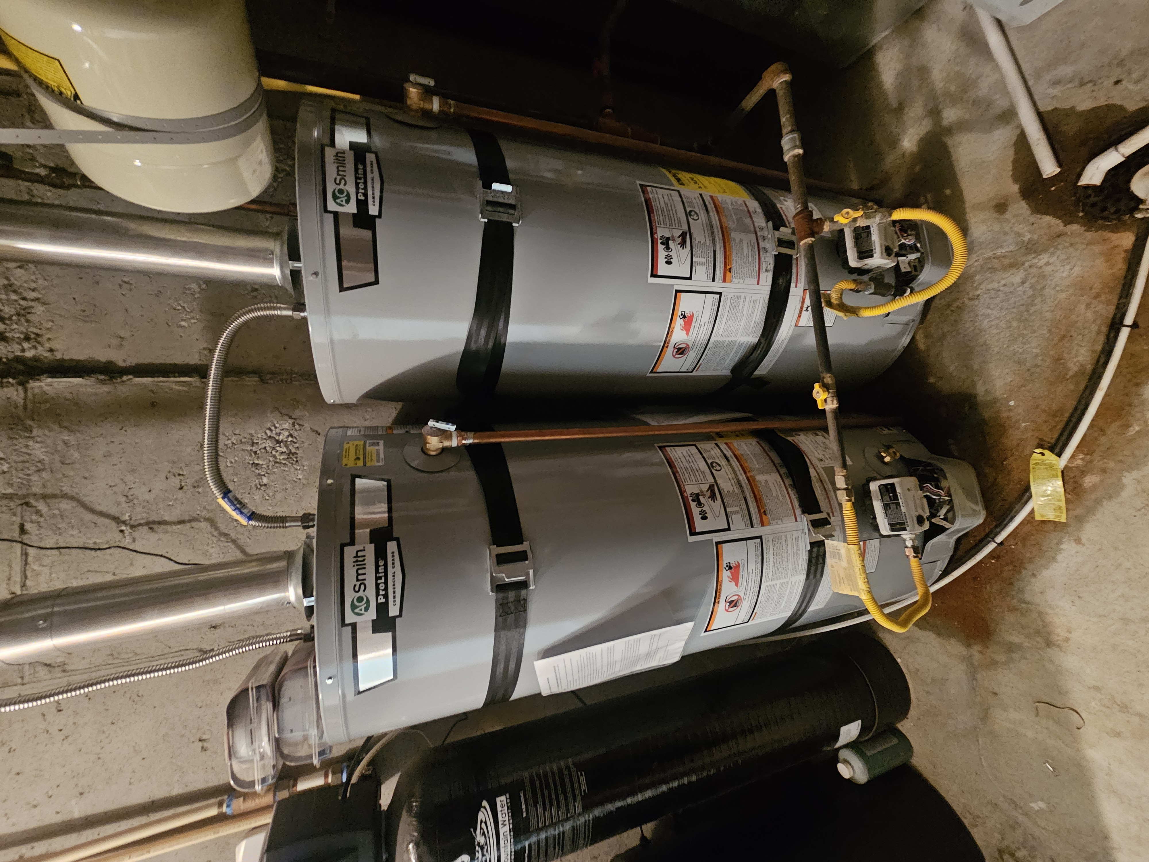 Two A.O. Smith ProLine 50-gallon gas water heaters installed side by side in Pleasant Grove, Utah